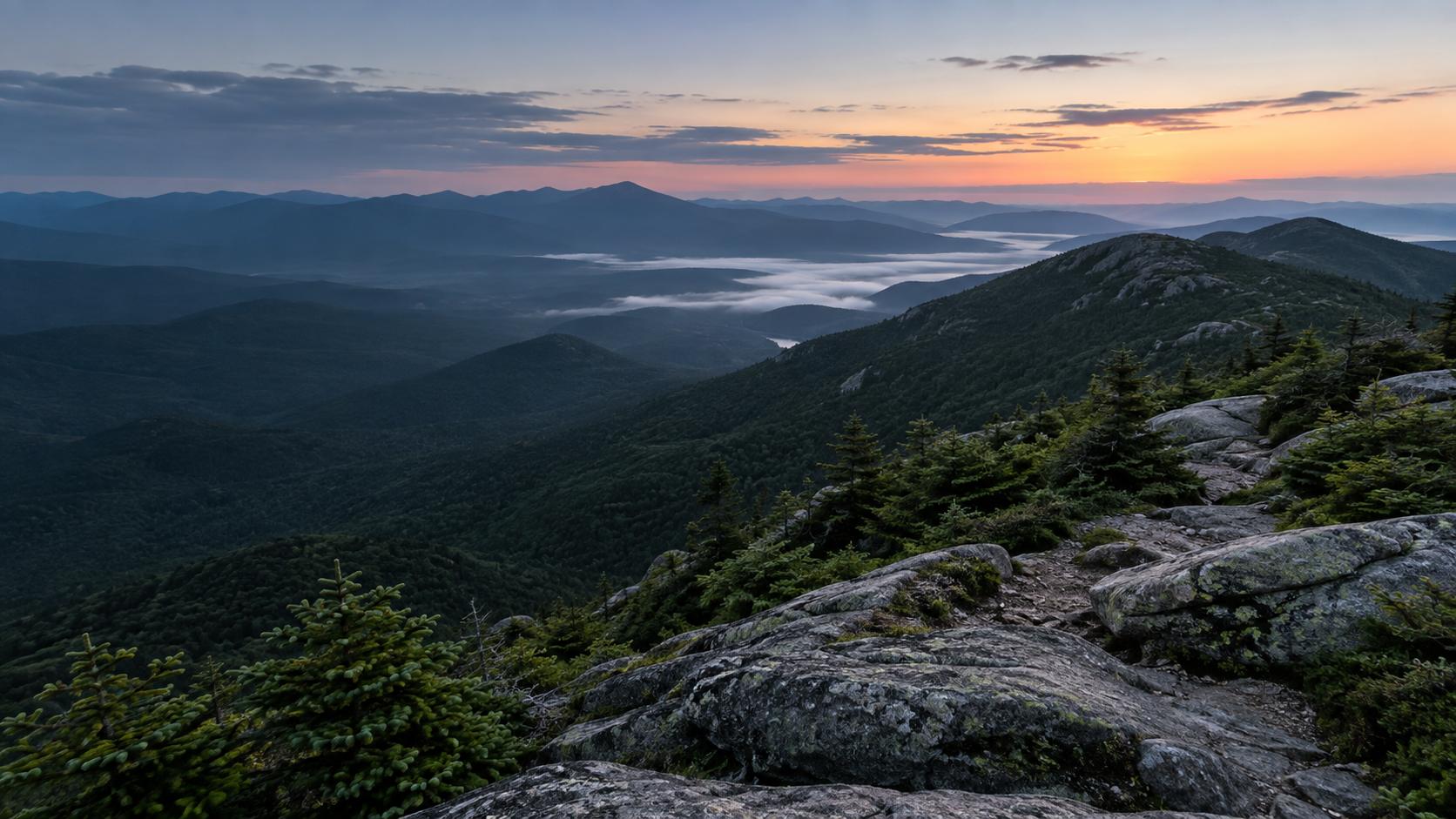 Granite, spruce, and layered mountain ridges at daybreak